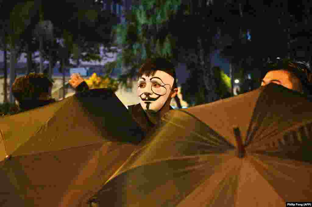 A protester wearing a mask takes part in a protest in the Wanchai district in Hong Kong on October 4. (AFP/Philip Fong)