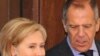 Russian Foreign Minister Sergei Lavrov speaks with U.S. Secretary of State Hillary Clinton in Moscow on October 13.