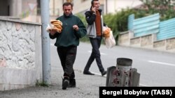 Nagorno Karabakh -- An unexploded Smerch rocket sticks out of the ground after a shelling attack in Stepanakert, October 9, 2020.