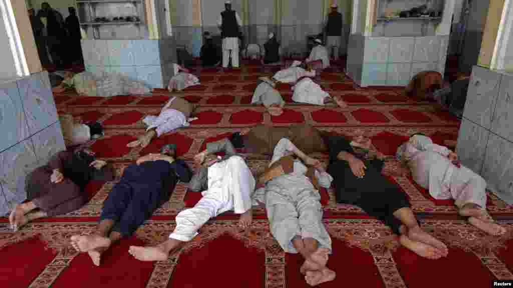 Afghan men sleep after prayer during the holy month of Ramadan at a mosque in Kabul on August 1. (REUTERS/Omar Sobhani)