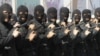 FILE: Iranian anti-narcotics police special forces hold their guns during a drill at a ceremony concluding maneuvers against drug smuggling in Iran's southeastern city of Zahedan, which is the capital of Sistan-Baluchestan.