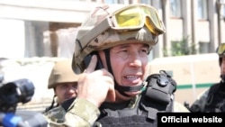 Ukrainian Defense Minister Valeriy Heletey in combat uniform in Slovyansk in July