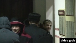 Syarhey Kavalenka (right) as he was escorted into the Vitebsk courtroom on February 24