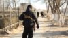 A police officer stands guard in Zhanaozen in the days after the December 2011 violence.