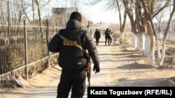 A police officer patrols the streets of Zhanaozen in December 2011, days after the clashes that killed 16 people.