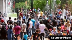 Young Iranians gathered to spray water on each other last week in Tehran.