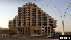 An Islamic State banner flies atop Mosul's Nineveh International Hotel.