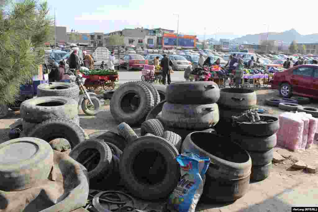 Afghanistan -- making rubber bucket, string, chair and table from used car tires in Kabul, 29 November 2015 