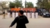 Karachi police officers guard the roads leading to the French Consulate after a protest against the French satirical magazine "Charlie Hedbo" turned violent in January.