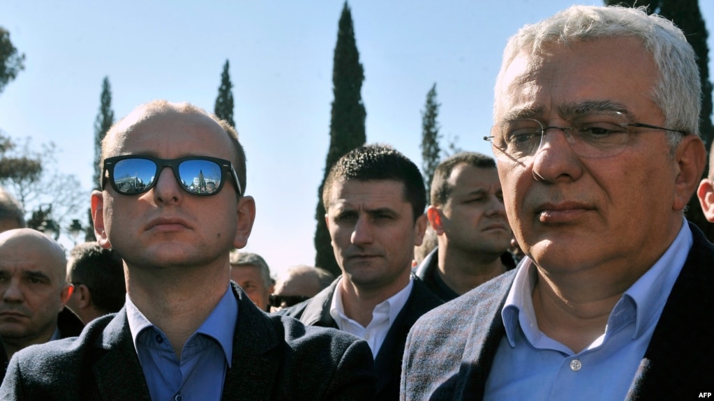 Montenegrin opposition leaders Andrija Mandic (right) and Milan Knezevic attend a protest in front of the parliament building in Podgorica on Februaru 15.