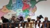 FILE: Members of the loya jirga listen during the first day of a four-day long meeting of around 2,500 Afghan tribal elders and leaders in Kabul (November, 2013).