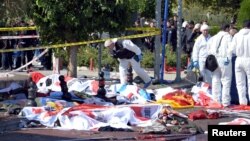 Turkey -- Police forensic experts examine the scene following explosions during a peace march in Ankara, 10Oct2015