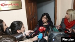 Armenia -- Taguhi Tovmasian, a parliament deputy and the founder of "Zhoghovurd" daily, speaks to reporters at the entrance to its offices, Yerevan, December 19, 2019.