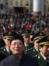 Military delegates leave the Great Hall of the People after the opening ceremony.