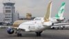 A Mahan airlines plane alongside Qatar airways in Mashhad International airport, undated. FILE PHOTO