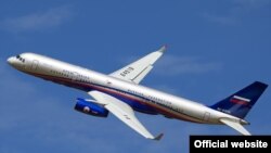 Russian Tupolev-214 airplane displays the Open Skies markings.