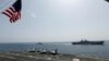 The Wasp-class amphibious assault ship USS Kearsarge (LHD 3) and the Arleigh Burke-class guided-missile destroyer USS Bainbridge (DDG 96) sail alongside the Nimitz-class aircraft carrier USS Abraham Lincoln (CVN 72), in the Arabian Sea, May 17, 