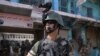 Pakistani soldiers patrol at an empty bazaar during a military operation against militants in the main town of Miran Shah in North Waziristan on July 9, 2014.