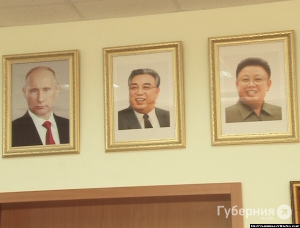 Ким Ир сен и Ким Чен Ир портреты