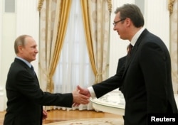 Russian President Vladimir Putin (left) greets Serbian Prime Minister Aleksandar Vucic during their meeting in Moscow in May 2016.