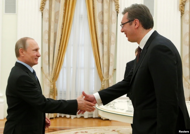 Russian President Vladimir Putin (left) greets Serbian Prime Minister Aleksandar Vucic during their meeting in Moscow in May 2016.