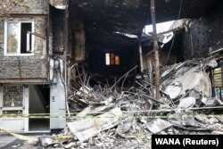 The ruins of a burnt bank are seen after protests against increased fuel prices in Tehran, November 20, 2019
