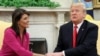 U.S. President Donald Trump greets UN Ambassador Nikki Haley in the Oval Office as the president accepted Haley's resignation on October 9.