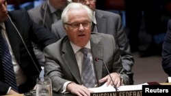 Russian Ambassador to the United Nations Vitaly Churkin speaks during a UN Security Council meeting following a vote to approve a resolution at UN headquarters in New York on July 20.