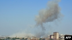 A plume of smoke is seen on the Baghdad skyline following the attack.