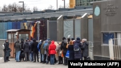 People wait in line to get their visas at the U.S. Embassy in Moscow.