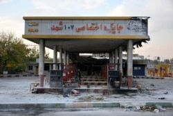 A picture taken on November 17 shows a scorched gas station that was set ablaze by protesters during a demonstration in Eslamshahr, near Tehran.
