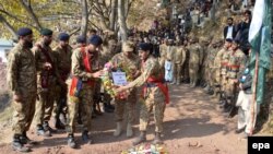 FILE: Pakistani Army soldiers attend a funeral ceremony of their comrade killed during clashes across the Line of Control, the de facto border between Pakistani and Indian administered parts of Kashmir, during his funeral in November 2016.