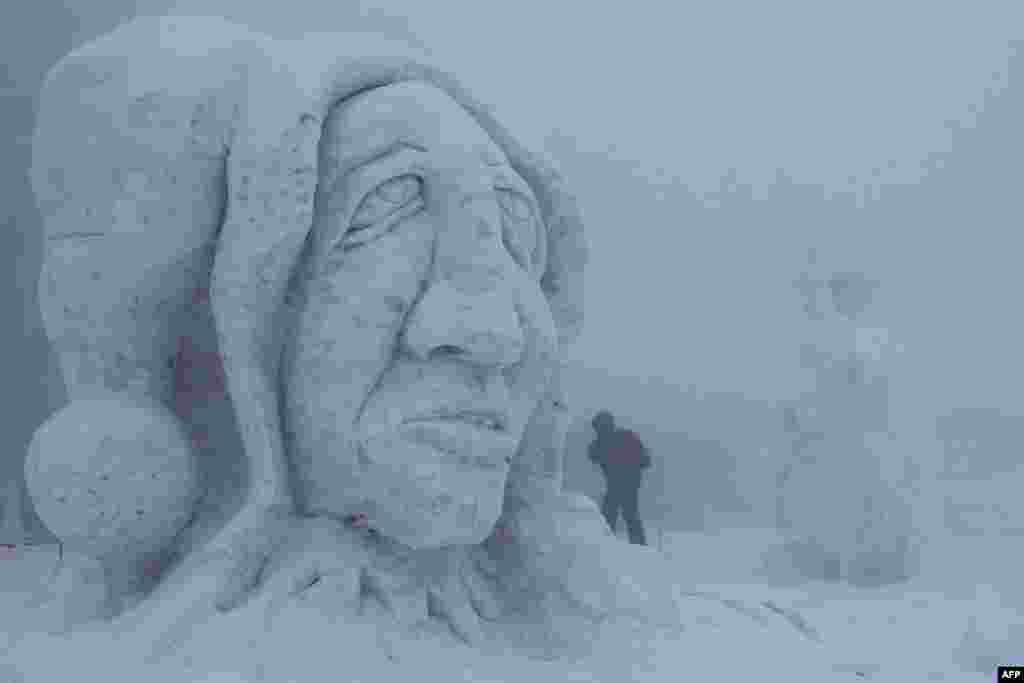 A snow sculpture is pictured during the 15th International Sculpture Symposium &quot;Snow Kingdom 2013&quot; in Pustevny, Czech Republic. The event attracts more than 30 artists and is attended by around 10,000 visitors. (AFP/Radek Mica)