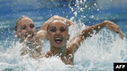 Russia's Natalia Ishchenko and Svetlana Romashina led their team in winning the gold in synchronized swimming at the Rio Olympics.