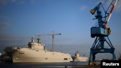 Two Mistral-class helicopter carriers, the Sevastopol (left) and the Vladivostok at a shipyard in Saint-Nazaire, France. 