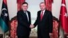 Түркиянын президенти Режеп Тайып Эрдоган жана Ливиядагы Улуттук ынтымак өкмөтүнүн башчысы Фаиз Сарраж. 27-ноябрь, 2019-жыл. Стамбул.