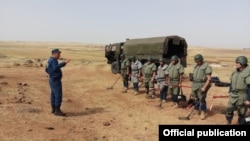 Syria -- Armenian demining experts prepare to clear a minefield near Aleppo. (Photo by the Armenian Center for Humanitarian Demining and Expertise.)