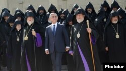 Armenia - President Serzh Sarkisian (C), Catholicos Garegin II (R) and Catholicos Aram I (L) and other clerics after the opening session of the Bishops' Synod in Echmiadzin, 24Sep2013.