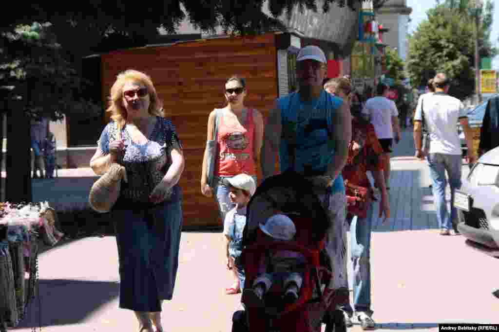 Families stroll in Luhansk.
