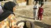 A woman makes bread at a camp for internally displaced Iraqis in central Baghdad. (file photo)