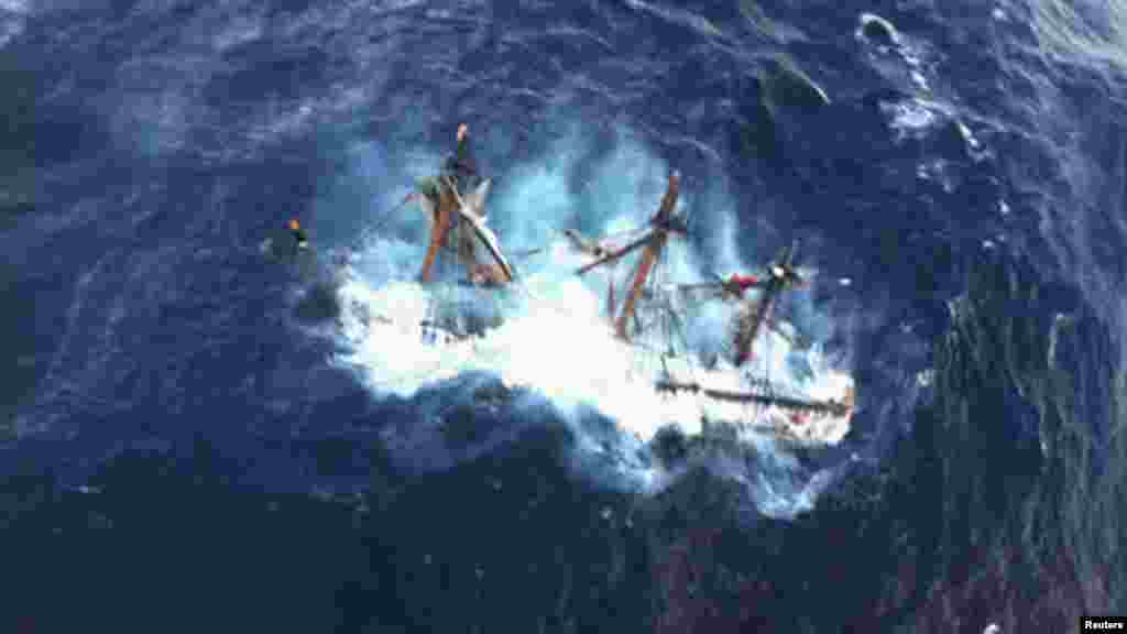 The "HMS Bounty," a replica of an 18th-century sailing vessel, is shown submerged in the Atlantic Ocean southeast of Hatteras, North Carolina. At least one crew member died and another, the captain, is still missing.