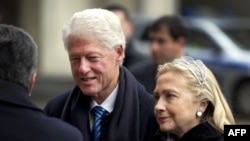 Former U.S. President Bill Clinton (left) and U.S. Secretary of State Hillary Clinton arrive for Vaclav Havel's funeral service in Prague.