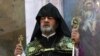 Armenia -- Archbishop Navasard Kchoyan leads a ceremony in St. Sargis Church, Yerevan, September 2, 2014.