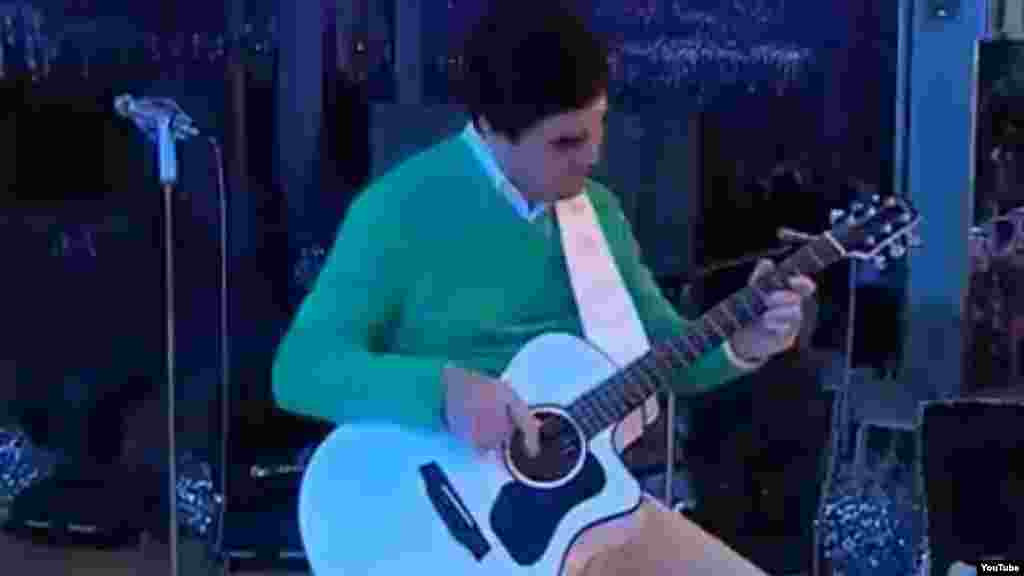 Berdymukhammedov has even performed pop songs in an attempt to build his own personality cult. Here, he plays an all-white guitar for a performance backed by singers dressed in white and playing white instruments.