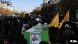 FILE: The burial procession of an Afghan fighter in Iran after he was killed in Syria.