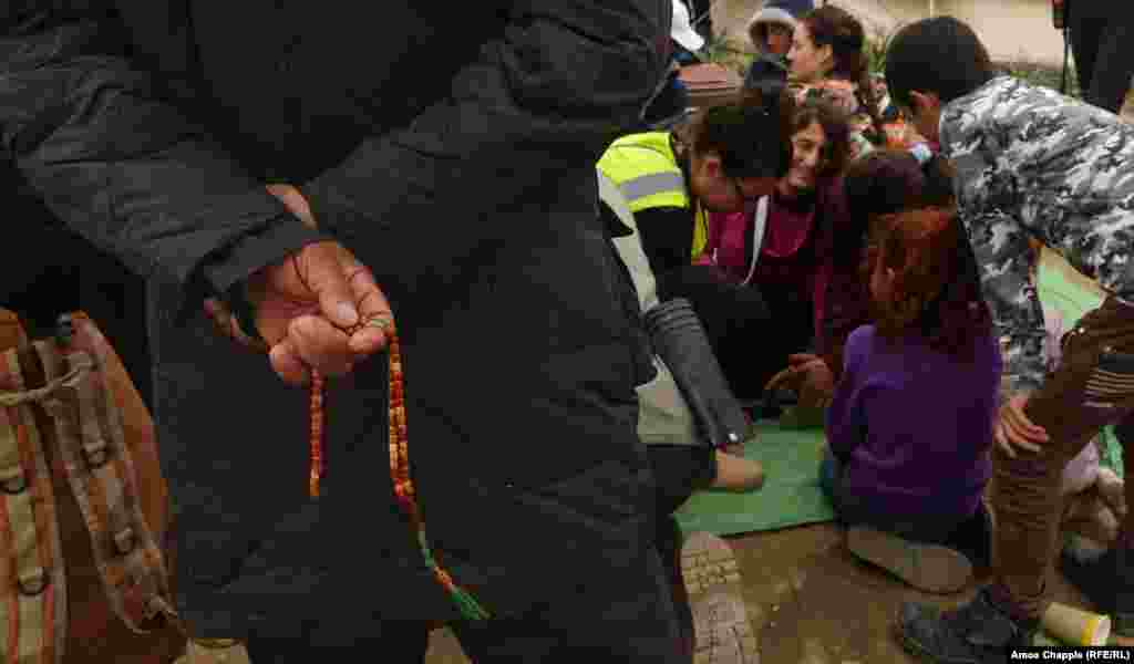 The classes attract a small crowd in the Moria refugee camp.