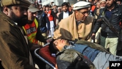 Rescuers taking an injured man to a hospital following an attack by gunmen on the Bacha Khan university in Charsadda near Peshawar in Pakistan's Khyber Pakhtunkhwa province on January 20.