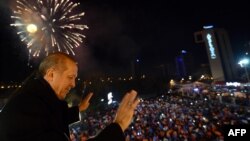 Turkish Prime Minister Tayyip Erdogan greets his supporters in Ankara after his party's strong showing in local elections on March 30.