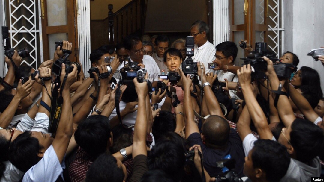 Pro-democracy leader Aung San Suu Kyi speaks to reporters after meeting with UN special envoy to Myanmar Vijay Nambiar in May.