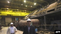 Iran's Atomic Energy Organization officials at the Bushehr nuclear power plant in southern Iran in February 2009